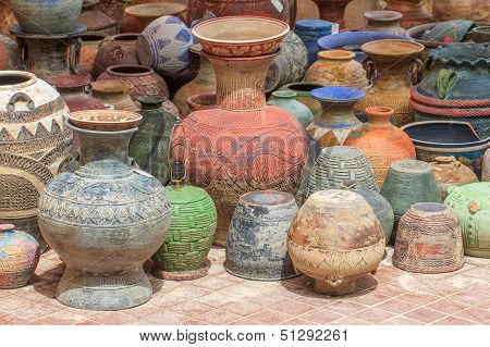 Shaped pottery vase lined on floor