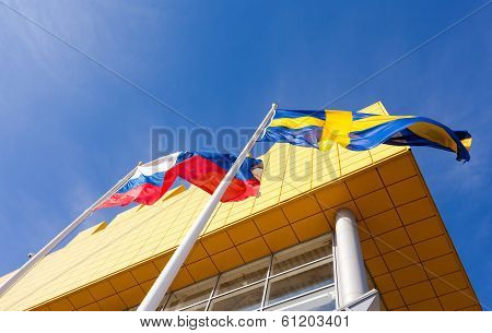 Samara, Russia - March 9, 2014: Flags Of Russia And Sweden Near Ikea Samara Store. Ikea Is The World