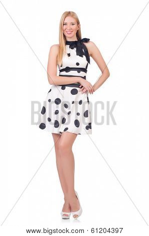 Tall model dressed in dress with polka dosts on white