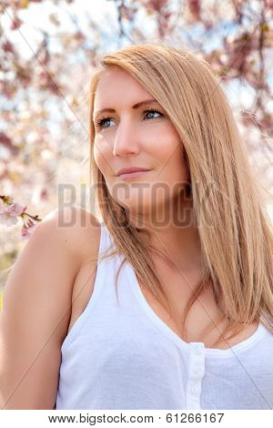 romantic female portrait oiutdoor in flower park