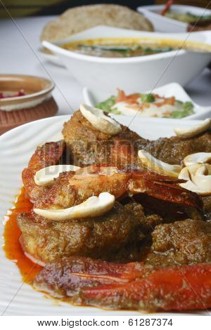 Narkel chingri, a prawn dish from India