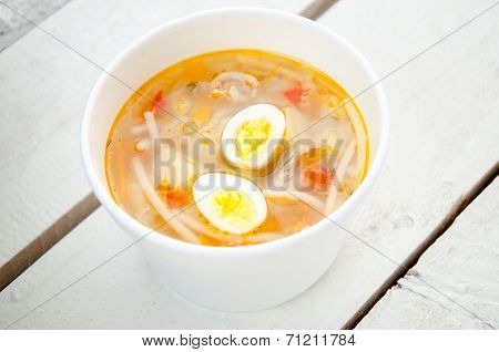 Chicken Soup With Noodles And Boiled Eggs