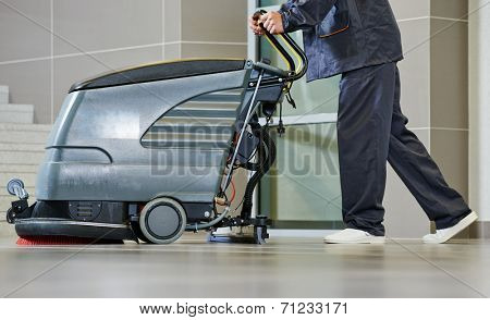 Floor care and cleaning services with washing machine in supermarket shop store