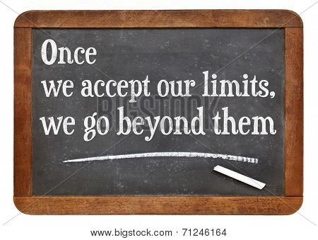 once we accept our limits, we go beyond them - a quote from Albert Einstein on a vintage slate blackboard