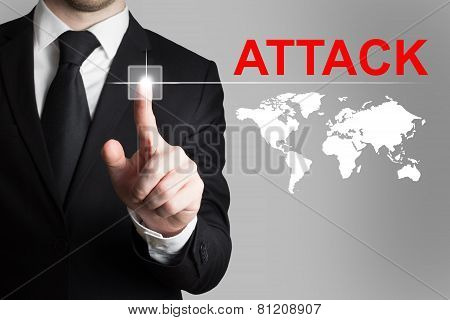 Businessman Pushing Button Attack International