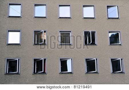 Facade of the building with windows partially opened