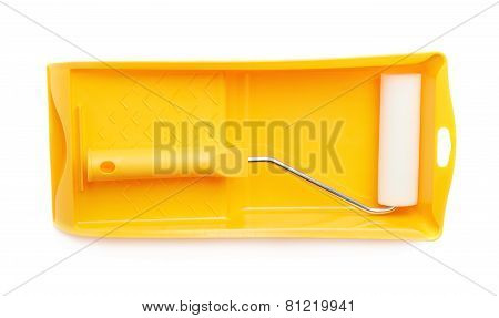 New paint roller in a tray