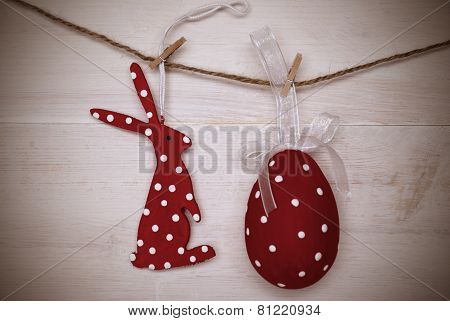 Red Easter Bunny And Easter Egg Hanging On Line With Frame