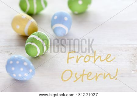 Blue Green And Yellow Easter Eggs With German Text Frohe Ostern Means Happy Easter