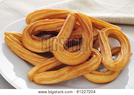 closeup of a plate with some churros typical of Spain