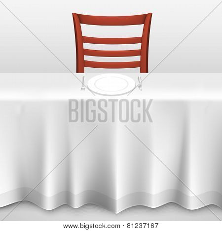 Table with a tablecloth and chair