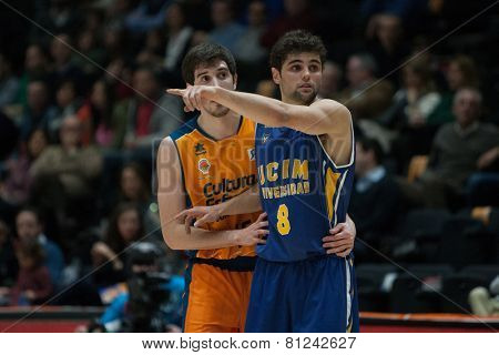 VALENCIA, SPAIN - JANUARY 24: Neto 8 and Vives during Spanish League match between Valencia Basket Club and UCAM Murcia at Fonteta Stadium on January 24, 2015 in Valencia, Spain