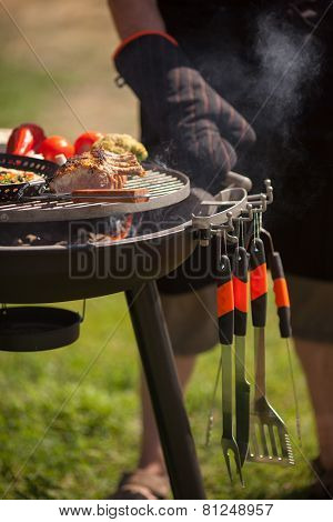 Fresh meat and vegetables on outdoor grill