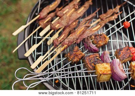 Fresh meat and vegetables on outdoor grill