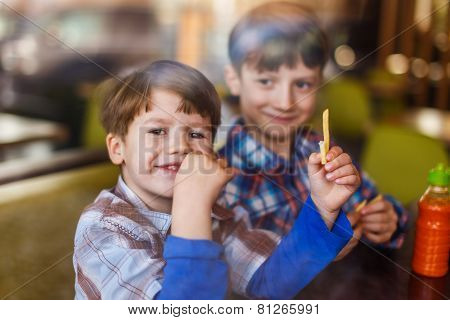 Little Preschooler Boys In Fast Food Restaurant