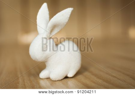 White Rabbit on wooden table