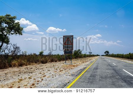 Endless Road With Blue Sky And Sign Elephants Crossing