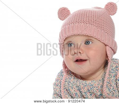 baby girl child lying down on white blanket smiling happy pink fashion portrait face studio shot isolated on white caucasian  hat warm cloting