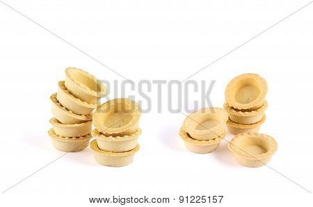 Pile of empty tartlets isolated