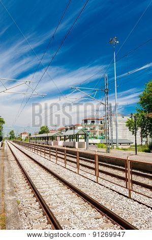 Railway goes to horizon near station Leptokarya, Greece