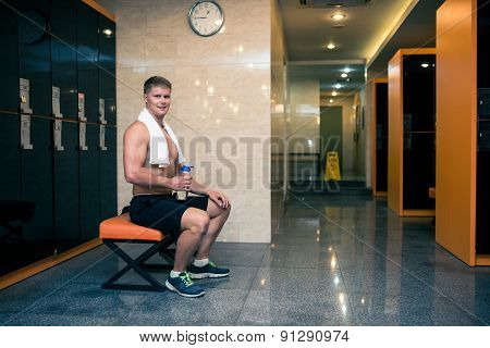 Sportsman in gym checkroom