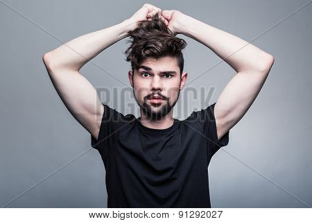 Professional studio portrait of young handsome man