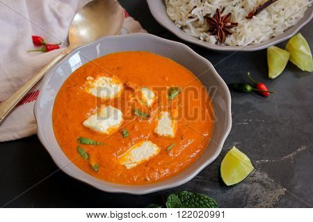 Paneer Butter masala and cooked rice Indian Curry vegetarian Dinner