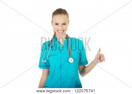 Woman doctor with thumbs up.