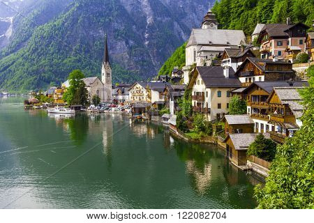 emerald lake and beautiful village Halstatt in Austrian Alps