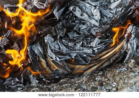 Burning office white paper in bonfire outside