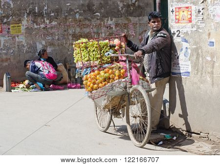 KATHMANDU NEPAL - CIRCA APRIL 2014: The street vendor selsl his fruits in Thamel in Kathmandu Nepal.