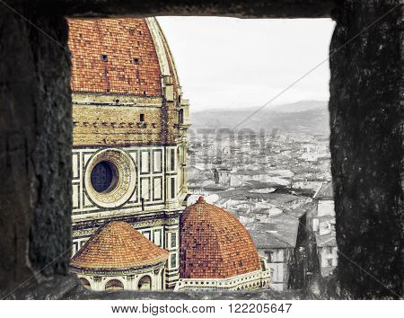 Duomo cathedral in Florence through the stone window. Sketch and photo. Art technique.