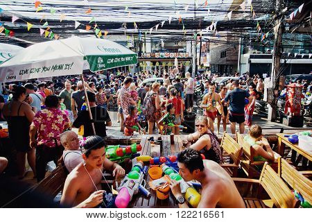 KO SAMUI, THAILAND - APRIL 13: ?rowd of unidentified people at the celebration of the water fight festival or Songkran Festival (Thai New Year) on April 13, 2014 in Chaweng Main Road, Ko Samui island, Thailand.