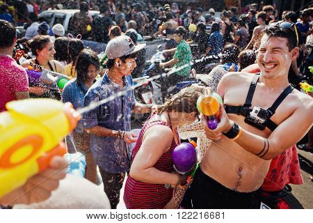 KO SAMUI, THAILAND - APRIL 13: Water fight in Songkran Festival (Thai New Year) on April 13, 2014 in Chaweng Main Road, Ko Samui island, Thailand.