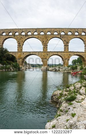 Pont du Gard, in Provence, France, over the Gardon river, is an 160 foot high roman aqueduct built to provide water to the city of Nimes from the river Eure near Uzes, in the first century A.D.