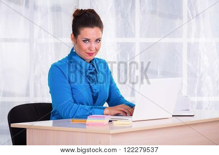 business woman. The girl in the office engaged in accounting.