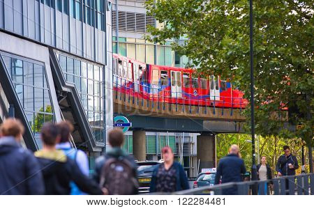 LONDON, UK - SEPTEMBER 17, 2015: People at the DLR station, light train railway of London