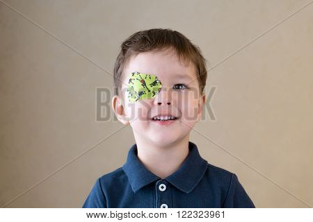 Eye patch. Portrait of a boy. Ophthalmology.