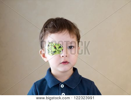 Eye patch. Portrait of a boy. Ophthalmology.
