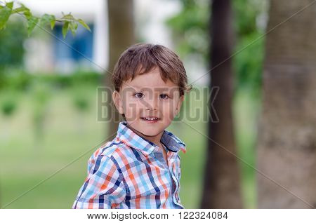Portrait of a boy on the nature. Summer. Smile of the Child.