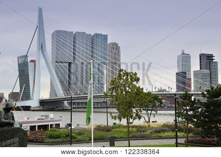 ROTTERDAM THE NETHERLANDS - 18 AUGUST: Rotterdam is a city modern architecture view on Erasmus Bridge and skyline of Rotterdam river Maas in Rotterdam Netherlands on August 182015.