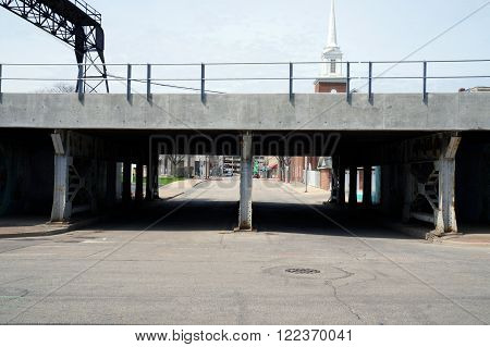 Pedestrians and motorists may pass under the rail tracks at the Van Buren Street viaduct in downtown Joliet, Illinois.