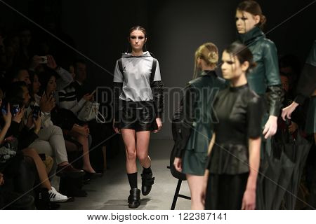 ISTANBUL, TURKEY - MARCH 16, 2016: A model showcases one of the latest creations of Murat Aytulum in Mercedes-Benz Fashion Week Istanbul
