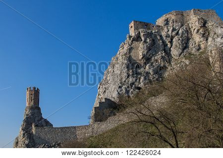 Rocky mountain with ruins of the castle on the top. Beside famous Maiden tower. Blue sky