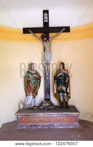 STITAR, CROATIA - AUGUST 27: St Valentine martyr and St. Vitus martyr under the crucifix in the chapel in the village Stitar, Croatia on August 27, 2015