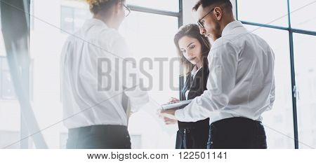 Business team work process. Photo young professionals crew working with new startup project. Project managers meeting. Analyze business plans laptop