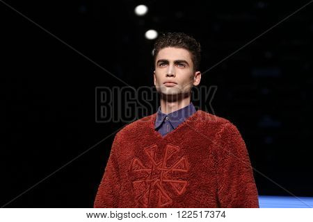 ISTANBUL, TURKEY - MARCH 17, 2016: A model showcases one of the latest creations of Can Yunus Cetinkaya in Mercedes-Benz Fashion Week Istanbul