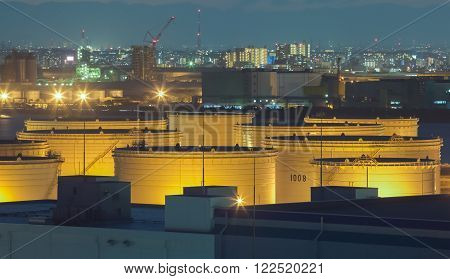 Oil tank at industrail zone and high building in the city in background
** Note: Shallow depth of field