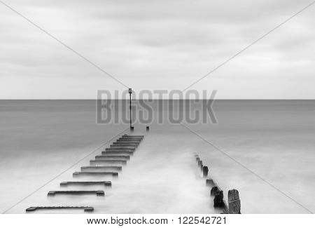 Long exposure landscape image of sea and groynes