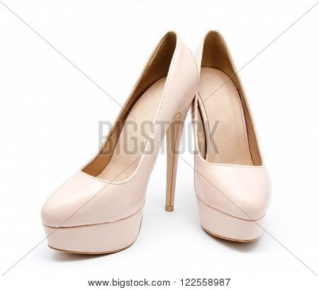 Biege high heel woman shoes isolated on a white background